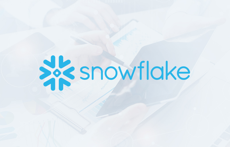 Faded image with the Snowflake logo overlay in blue